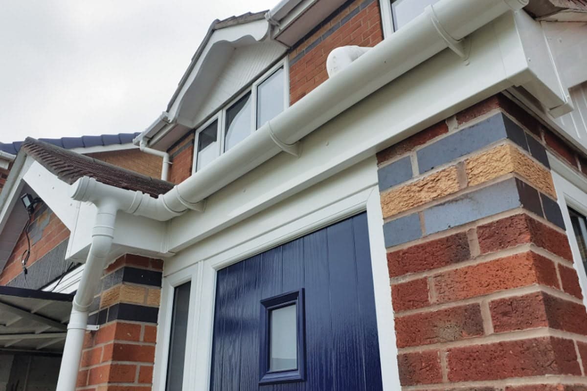 White fascia, soffit and guttering along a roof