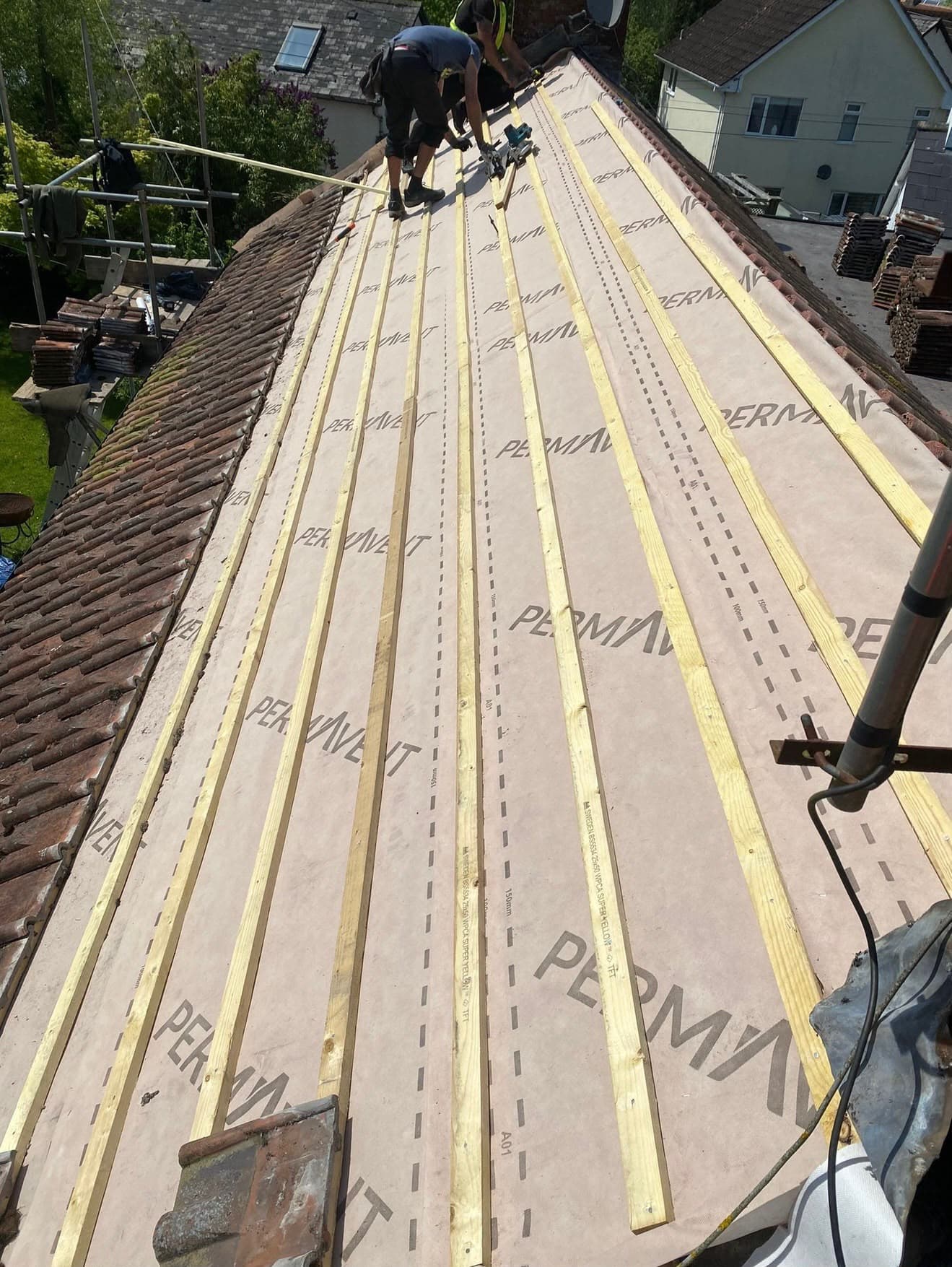 Roof membrane being installed beneath battens